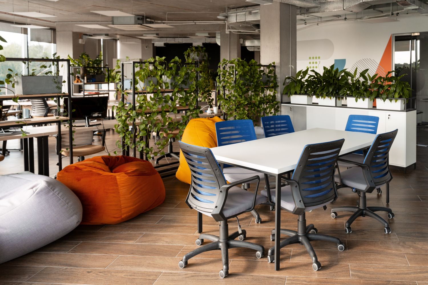 Collaborative tables and chairs arranged for group work in a modern workspace Collaborative tables and chairs arranged for group work in a modern workspace
